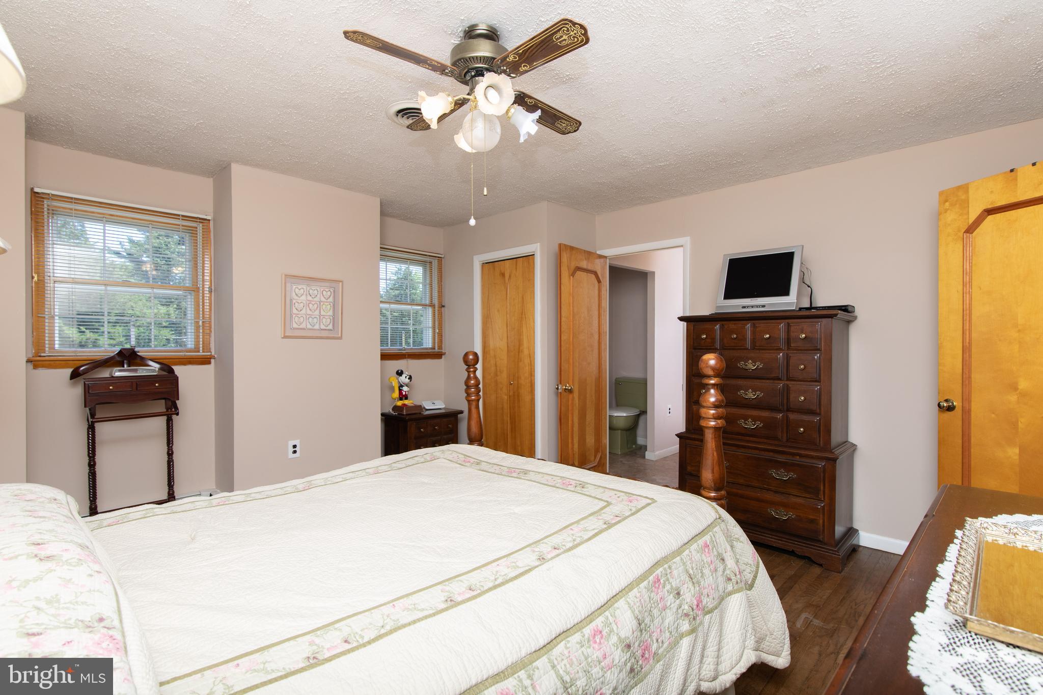 741 Heritage Road Sewell, NJ 08080 - Photo 34 of 60 a bedroom with a bed and a chandelier