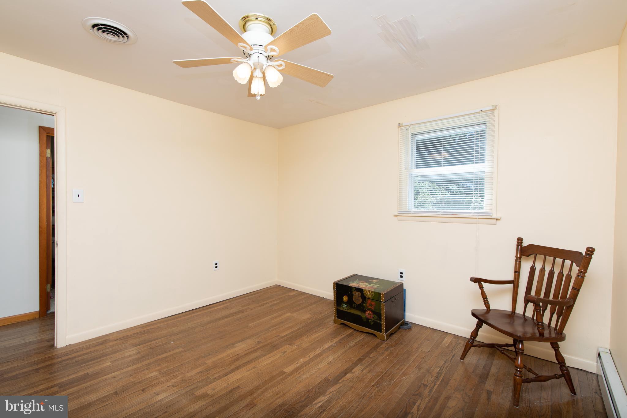 741 Heritage Road Sewell, NJ 08080 - Photo 38 of 60 a view of a workspace with furniture and wooden floor
