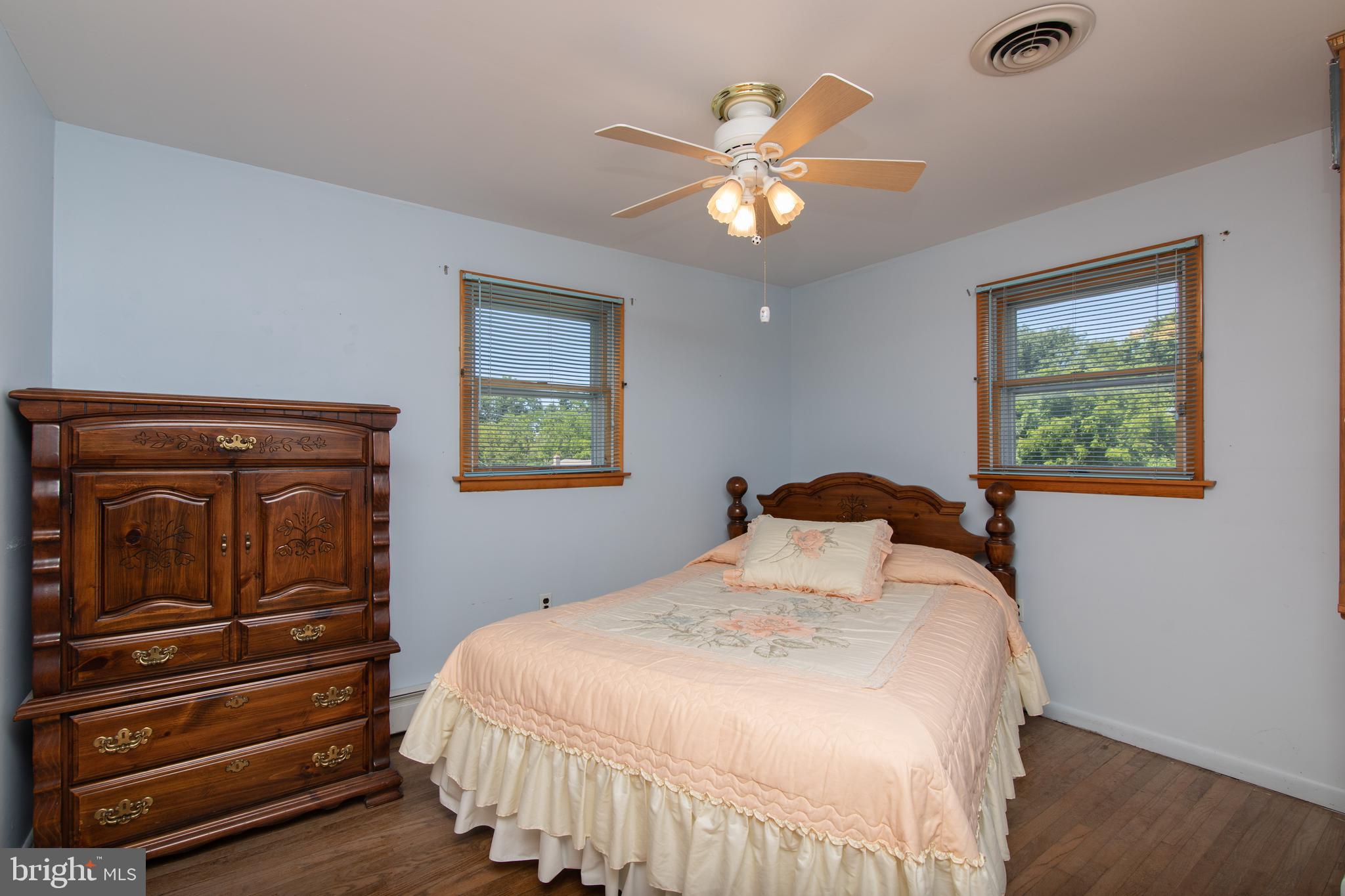 741 Heritage Road Sewell, NJ 08080 - Photo 40 of 60 a bedroom with a bed and a chandelier