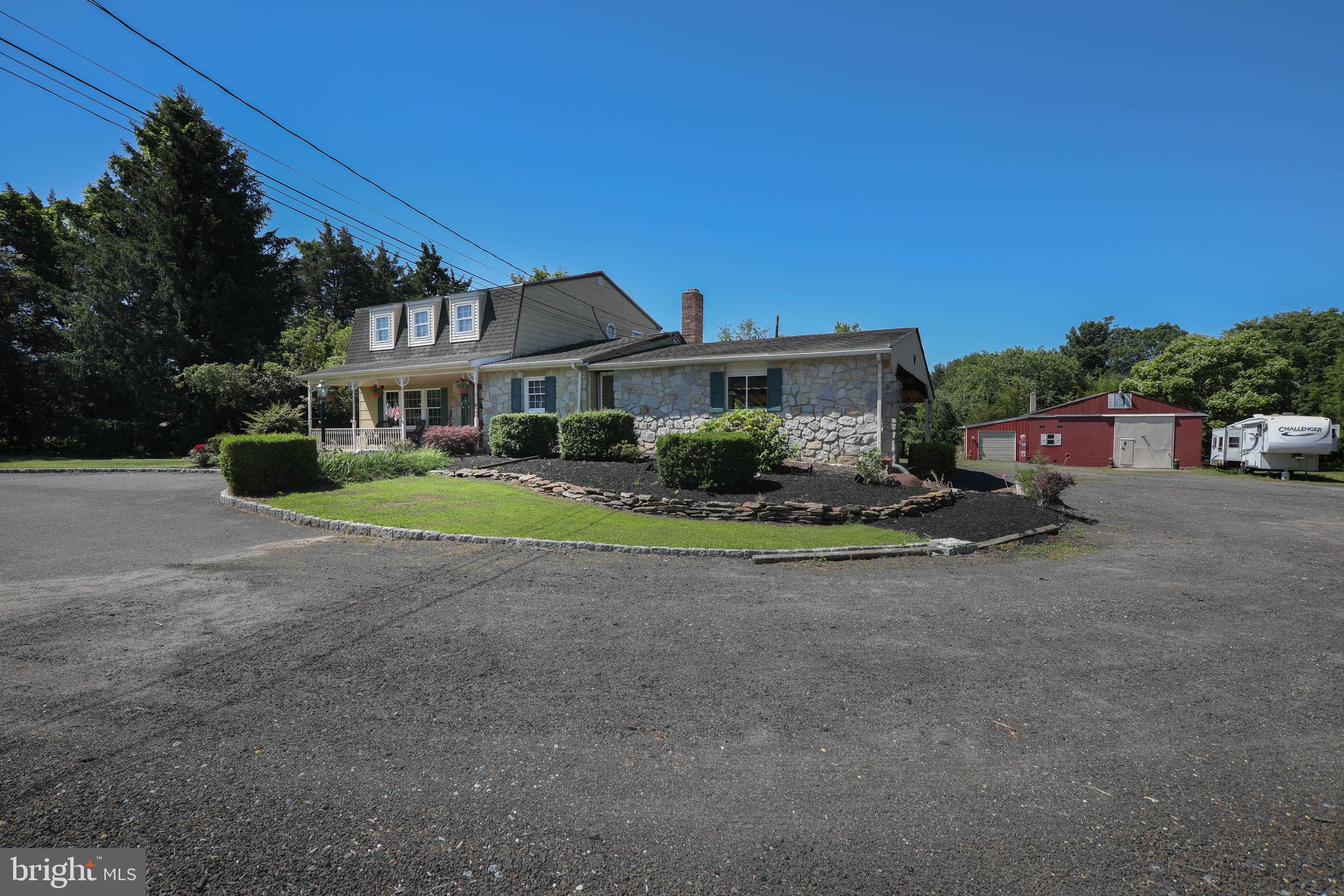 741 Heritage Road Sewell, NJ 08080 - Photo 5 of 60 a front view of a house with a yard