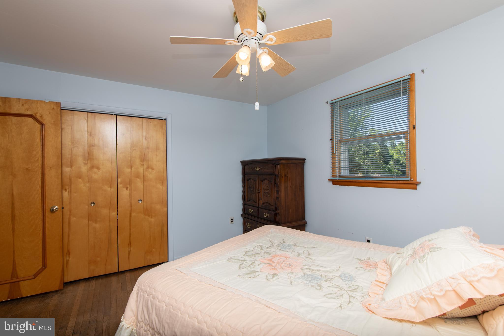 741 Heritage Road Sewell, NJ 08080 - Photo 41 of 60 a bedroom with a bed and a chandelier