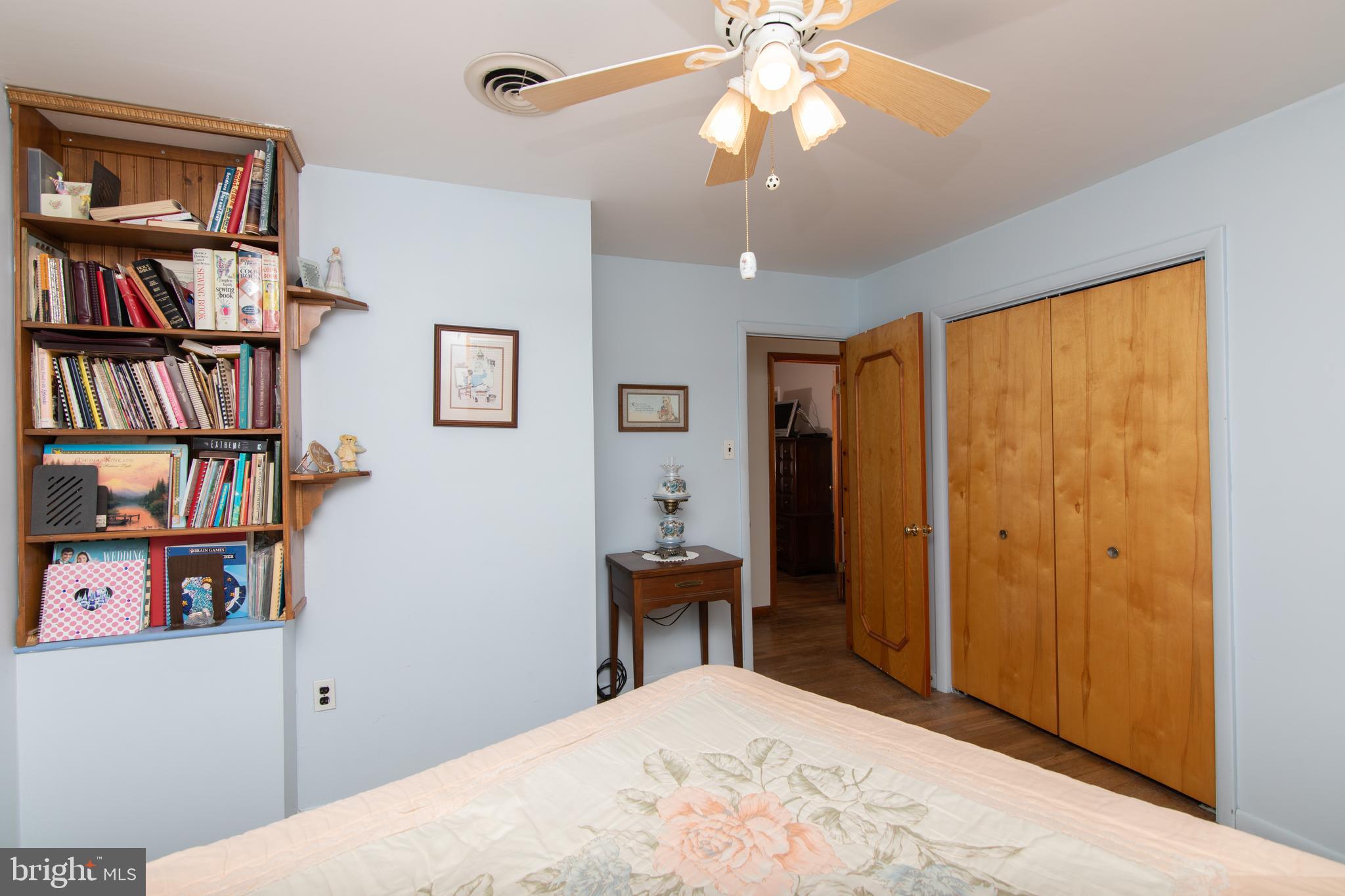 741 Heritage Road Sewell, NJ 08080 - Photo 42 of 60 a bedroom with a large bed and a book shelf