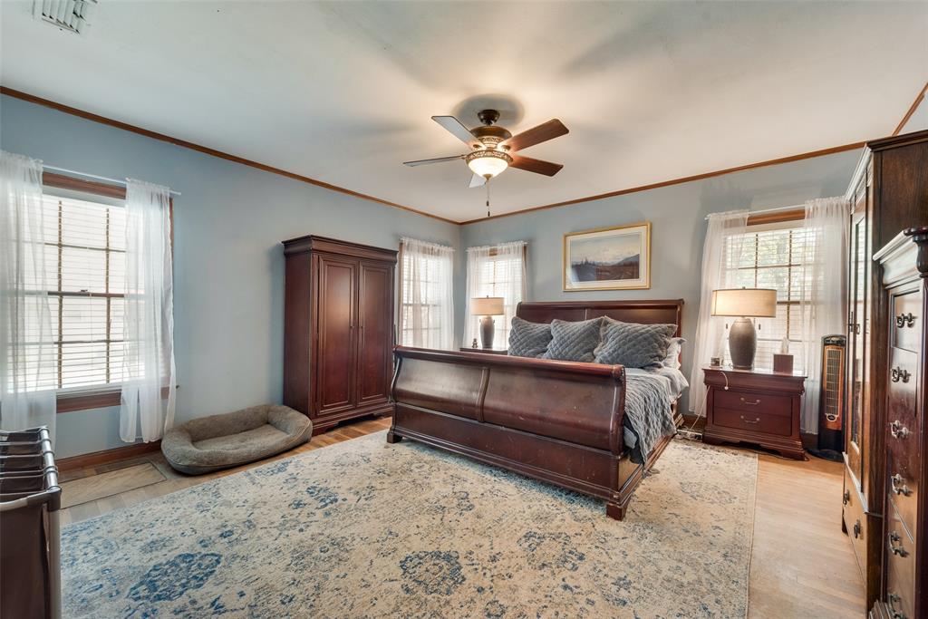 233 East High Street Wills Point, TX 75169 - Photo 18 of 40 Bedroom featuring crown molding, light wood-style floors, and a ceiling fan