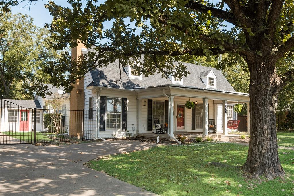 233 East High Street Wills Point, TX 75169 - Photo 2 of 40 Cape cod home with covered porch, a chimney, and roof with shingles