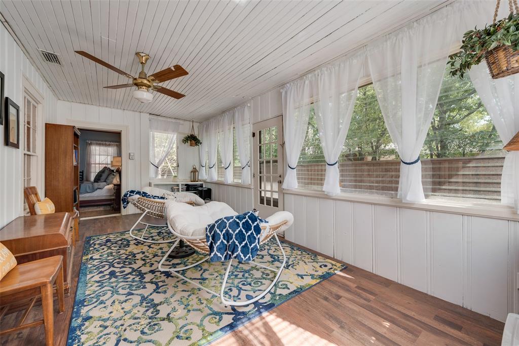 233 East High Street Wills Point, TX 75169 - Photo 23 of 40 Sunroom with a decorative wall, wood finished floors, wooden ceiling, and wood walls