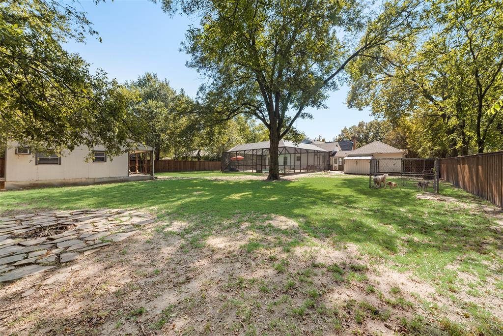 233 East High Street Wills Point, TX 75169 - Photo 37 of 40 Fenced backyard with a patio area and an outdoor structure