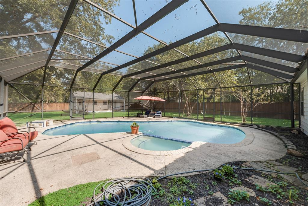 233 East High Street Wills Point, TX 75169 - Photo 38 of 40 Integrated pool / spa with a sunroom, a fenced backyard, a patio, and glass enclosure