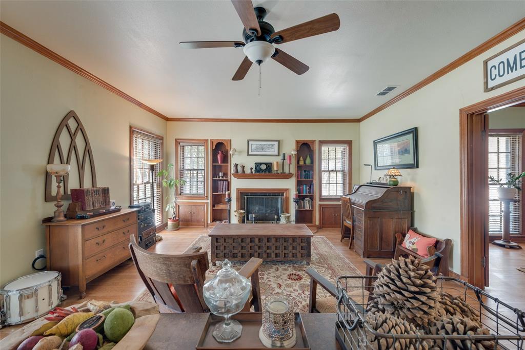 233 East High Street Wills Point, TX 75169 - Photo 4 of 40 Living room with ceiling fan, plenty of natural light, ornamental molding, and light wood finished floors