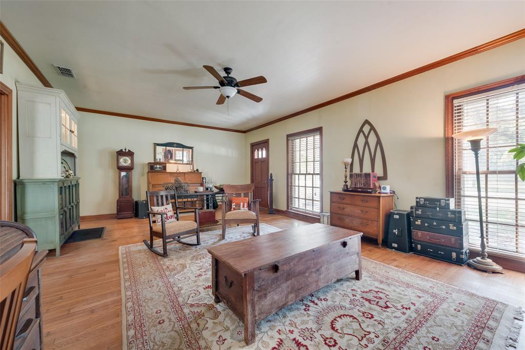 233 East High Street Wills Point, TX 75169 - Photo 7 of 40 Living area featuring light wood finished floors, ceiling fan, and ornamental molding
