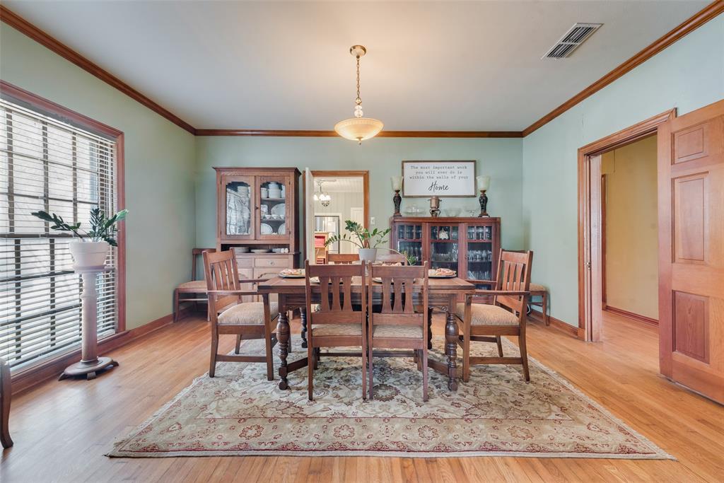 233 East High Street Wills Point, TX 75169 - Photo 8 of 40 Dining room featuring light wood-type flooring and crown molding