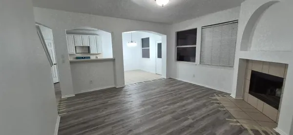 a view of a living room with a fireplace