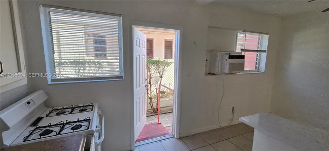 a kitchen that has a stove and a refrigerator