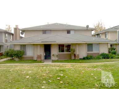 560 Spring Road, Unit 81 Moorpark, CA 93021 - Photo 1 of 14 a front view of a house with garden