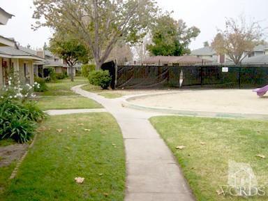 560 Spring Road, Unit 81 Moorpark, CA 93021 - Photo 2 of 14 a view of swimming pool with a yard and plants