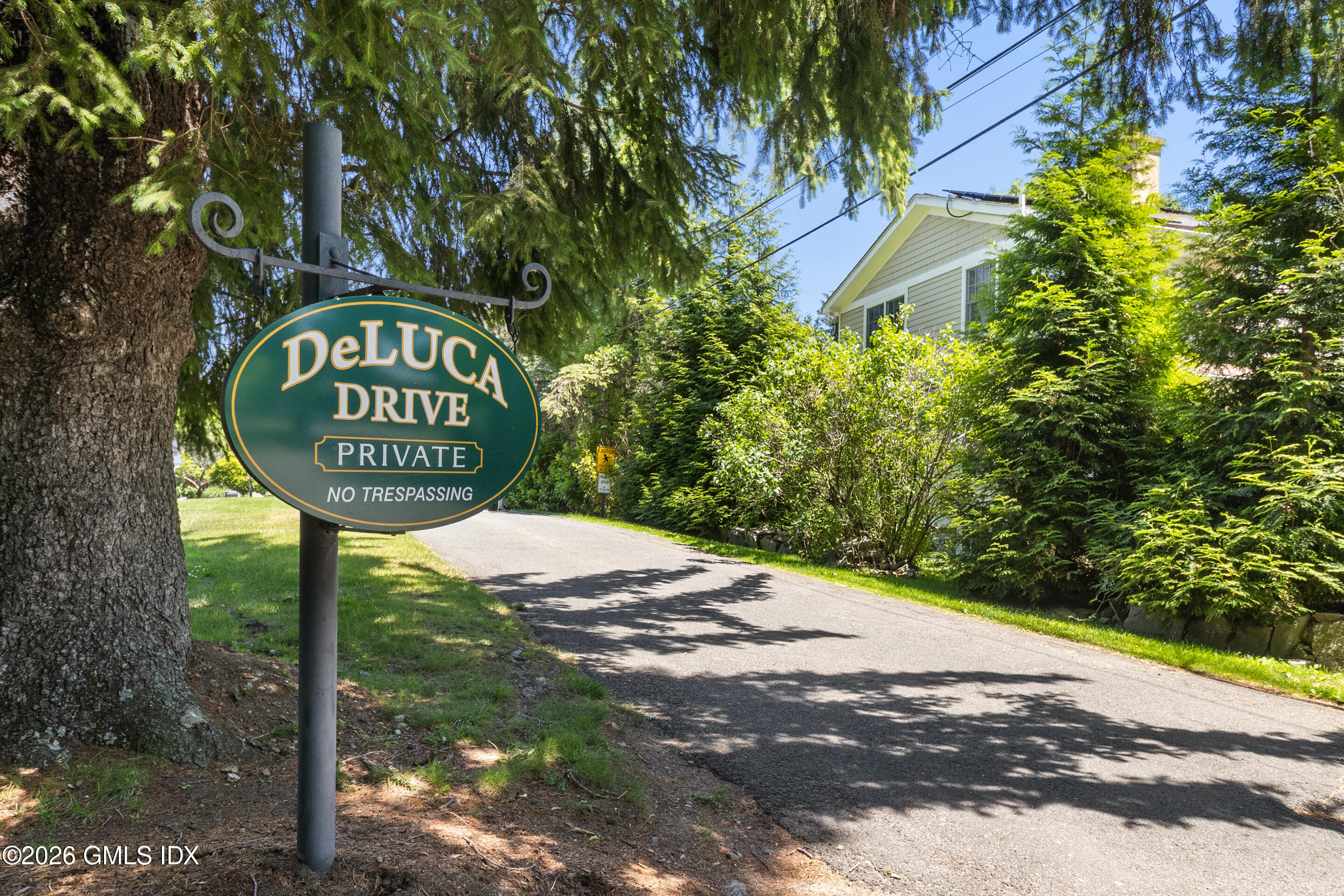 9 Deluca Drive Cos Cob, CT 06807 - Photo 30 of 30 a sign that is on the side of a road