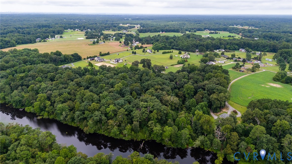 4363 Sandy Valley Road Mechanicsville, VA 23111 - Photo 7 of 19 a view of a lake with a city view