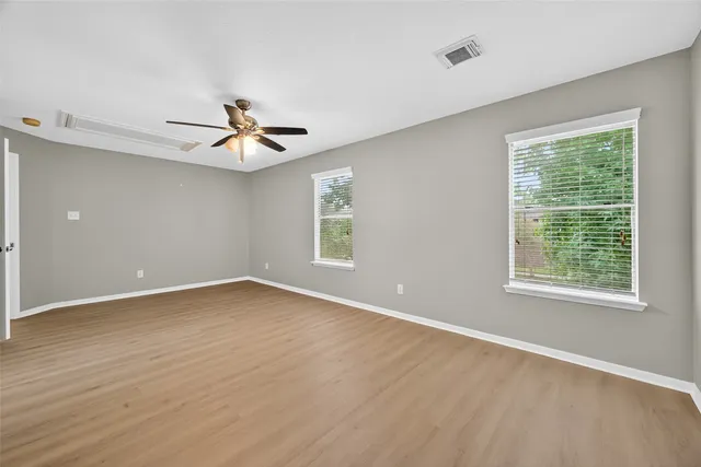 a bathroom with a double vanity sink a mirror and a shower