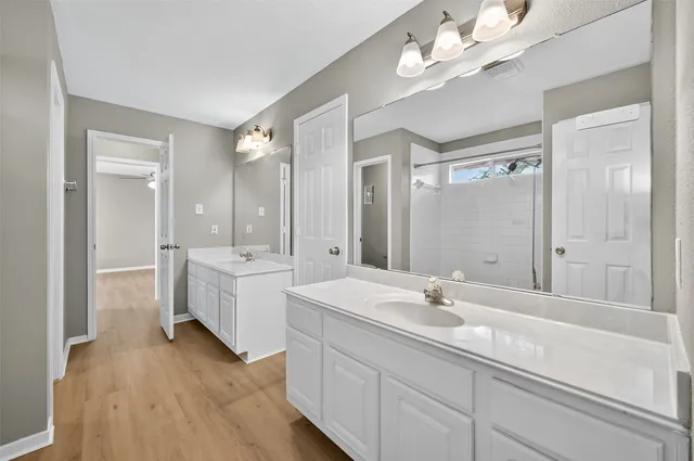 a bathroom with a bathtub and a shower