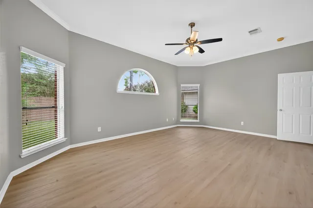 a spacious bathroom with a double vanity sink a mirror and a bathtub