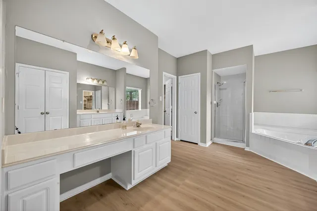 a bathroom with a sink vanity and a mirror