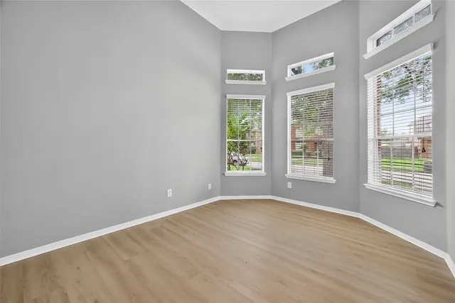 a living room with furniture a rug and a large window