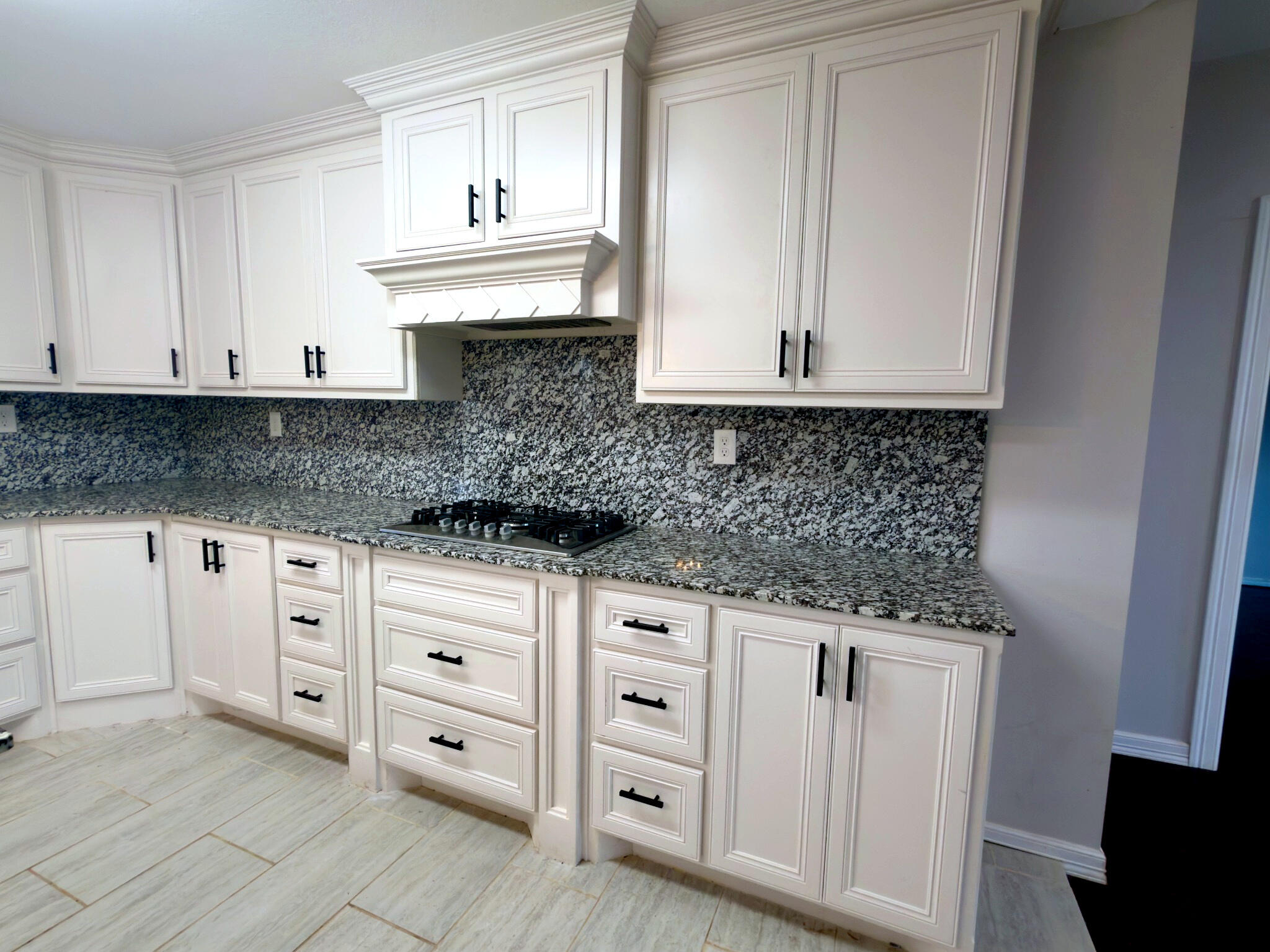 611 South Avenue H Post, TX 79356 - Photo 13 of 32 a kitchen with white cabinets and sink