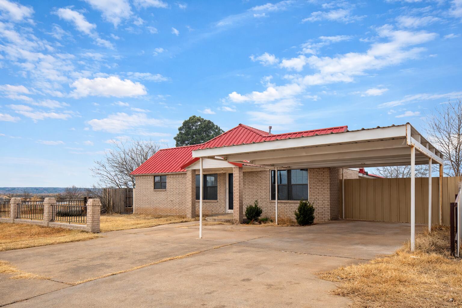 611 South Avenue H Post, TX 79356 - Photo 2 of 32 a view of a house with a patio