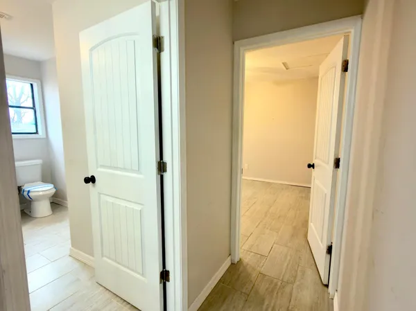 a view of bathroom with shower and toilet