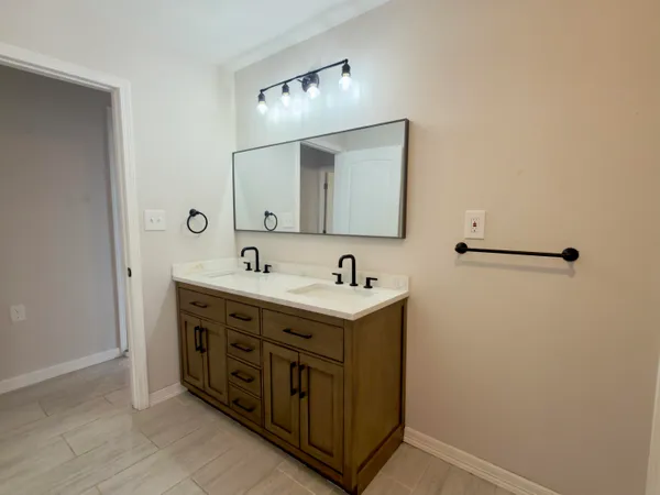 a bathroom with a sink and a mirror