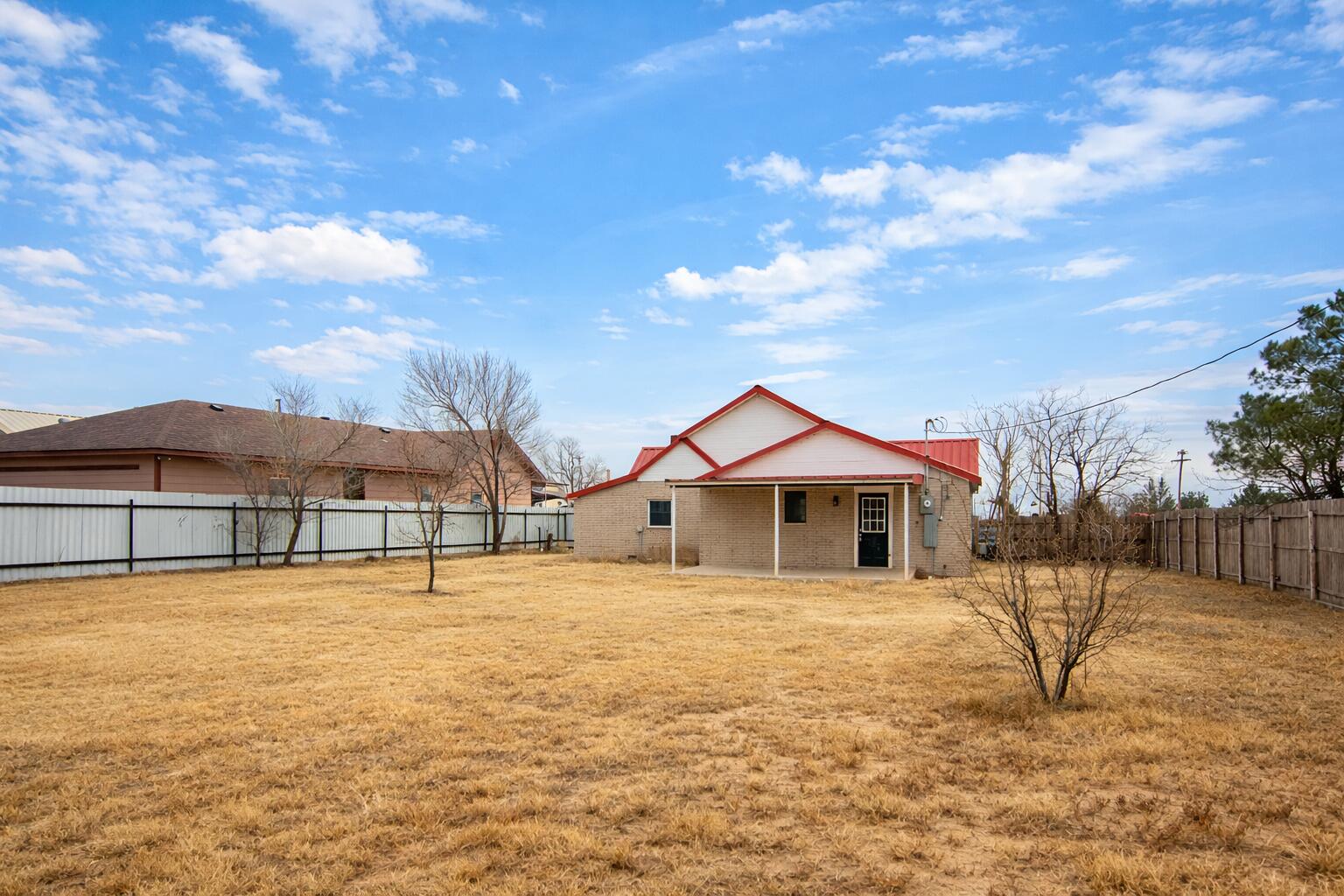 611 South Avenue H Post, TX 79356 - Photo 32 of 32 a front view of a house with a yard