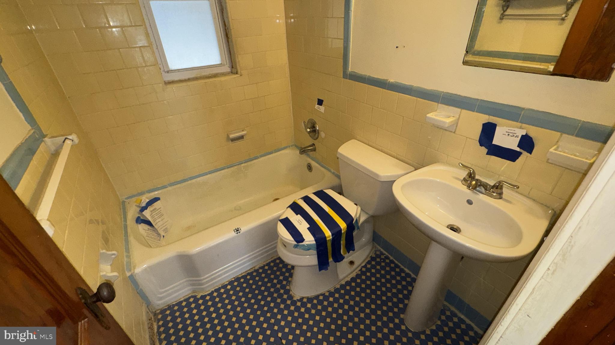 6502 Knollbrook Drive Hyattsville, MD 20783 - Photo 11 of 21 a bathroom with a sink and a mirror