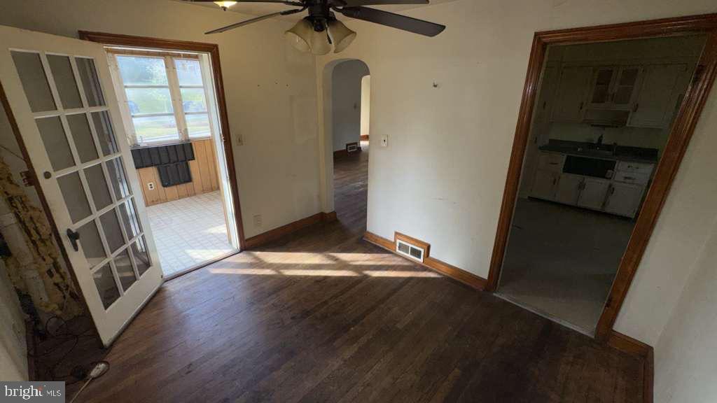 6502 Knollbrook Drive Hyattsville, MD 20783 - Photo 9 of 21 a view of empty room with wooden floor and fan