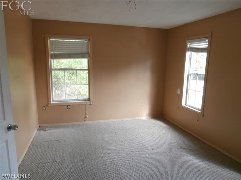 7615 Carrier Road Fort Myers, FL 33967 - Photo 4 of 8 an empty room with a window