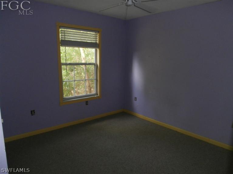 7615 Carrier Road Fort Myers, FL 33967 - Photo 6 of 8 an empty room with a window