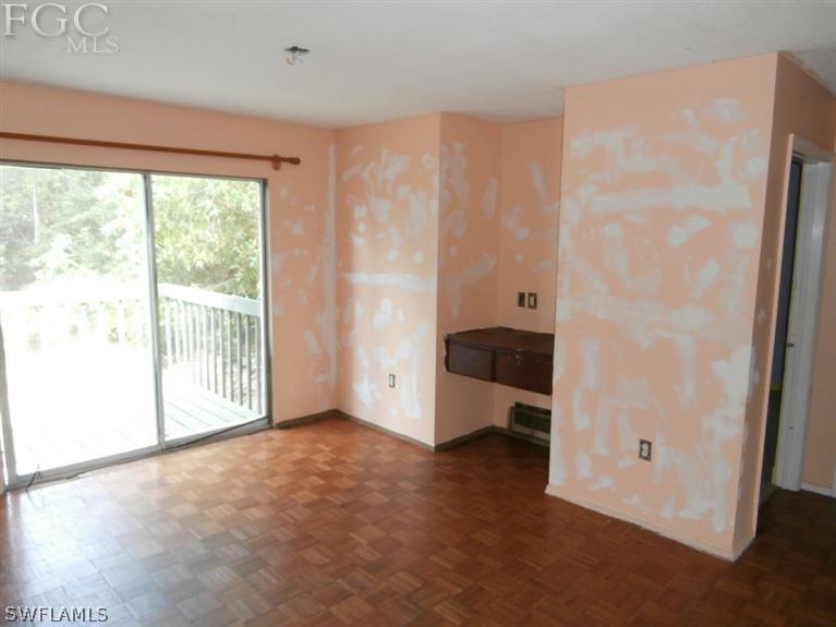 7615 Carrier Road Fort Myers, FL 33967 - Photo 7 of 8 a view of an empty room with a window