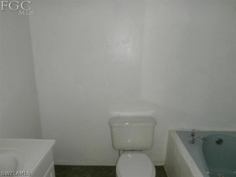 7615 Carrier Road Fort Myers, FL 33967 - Photo 8 of 8 a white toilet sitting next to a white sink