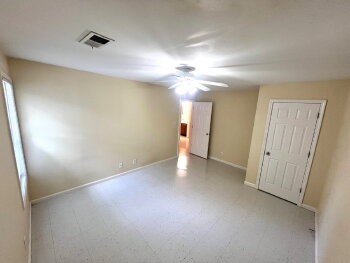 9063 Pembroke Road, Unit B Oak Grove, TN 42262 - Photo 7 of 12 an empty room with a ceiling fan and bathroom