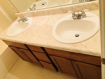 9063 Pembroke Road, Unit B Oak Grove, TN 42262 - Photo 10 of 12 a bathroom with a sink and mirror