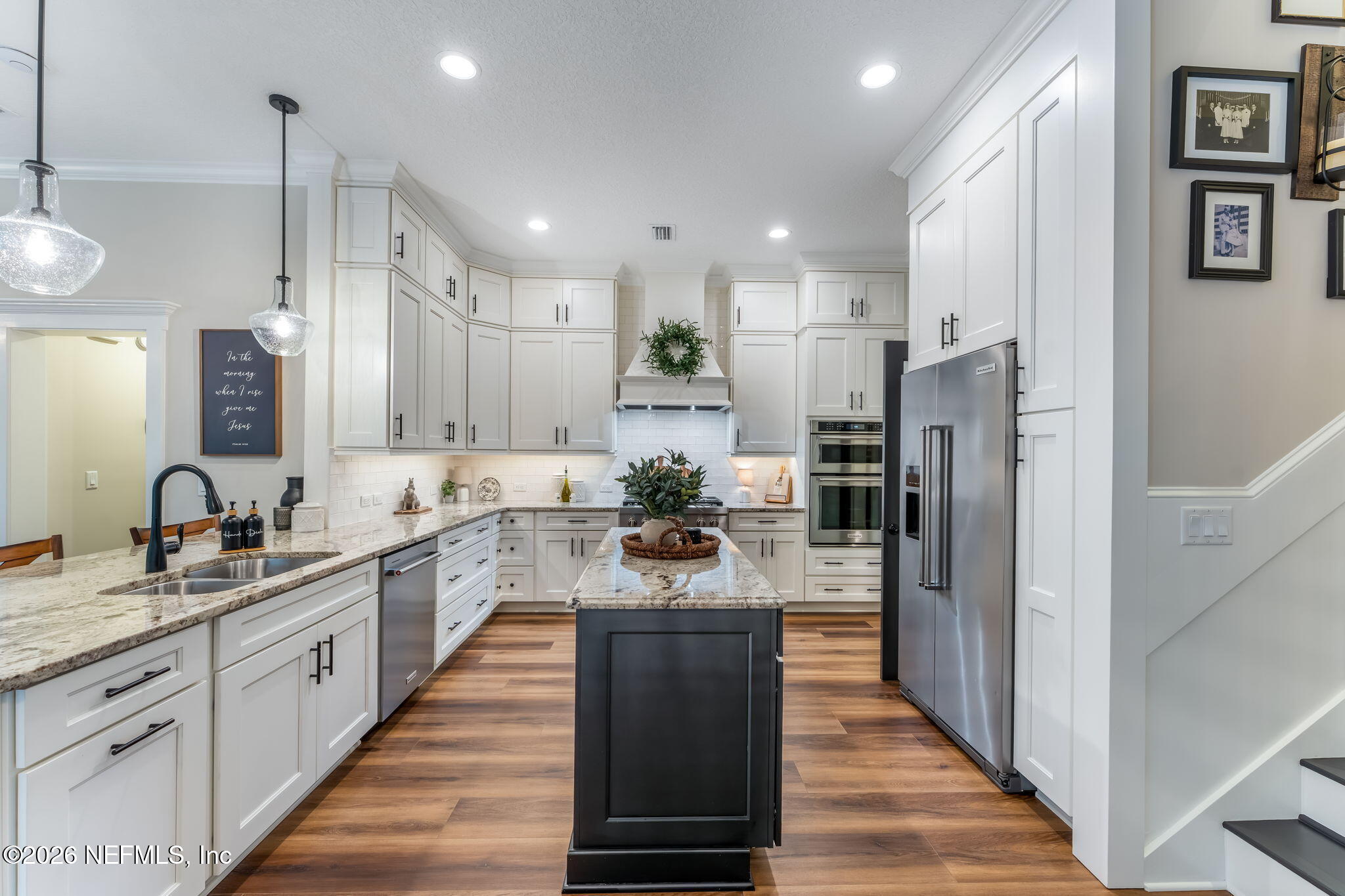 1204 Creek Bend Road St. Johns, FL 32259 - Photo 22 of 107 a large kitchen with stainless steel appliances lots of counter space and wooden floor