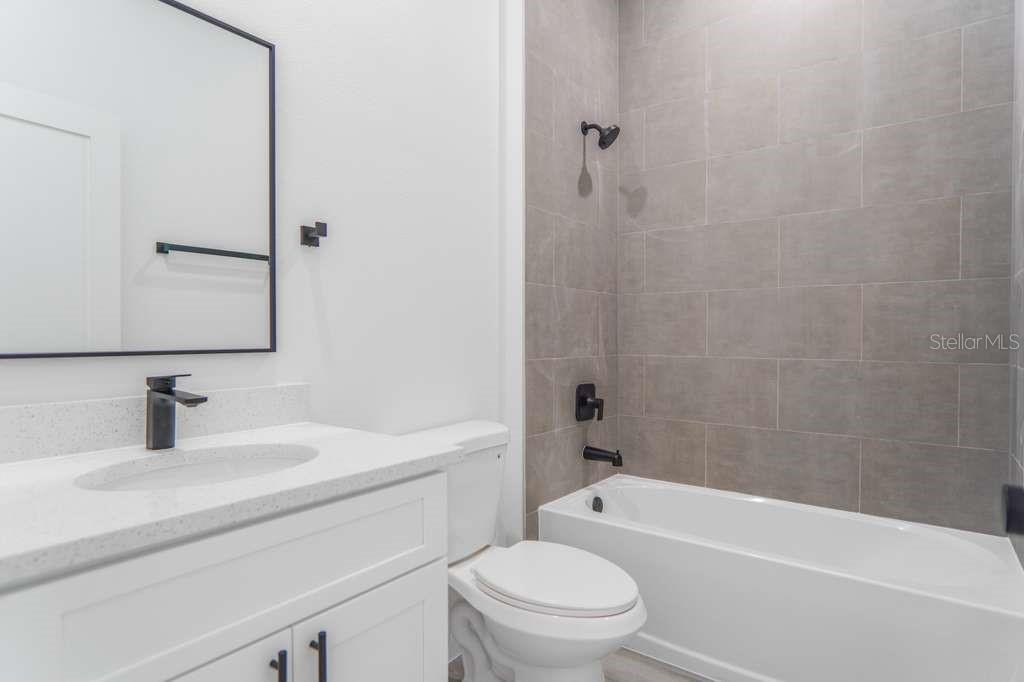 15683 Southwest 49th Avenue Road Ocala, FL 34473 - Photo 23 of 27 a bathroom with a sink a toilet and shower
