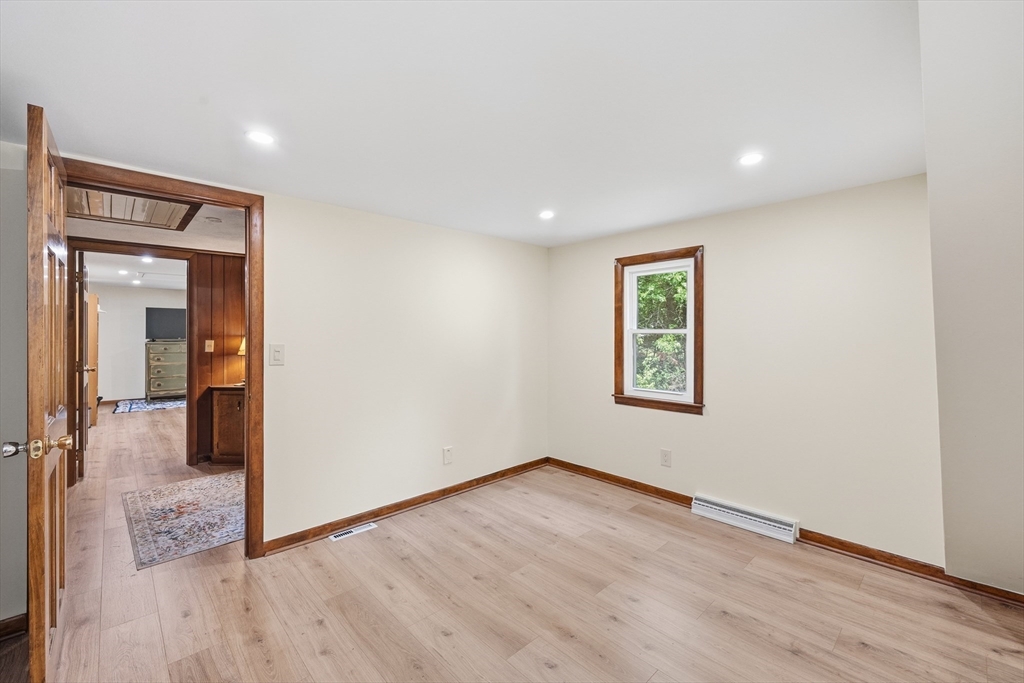 43 Flint Road Tyngsborough, MA 01879 - Photo 22 of 40 an empty room with wooden floor and windows