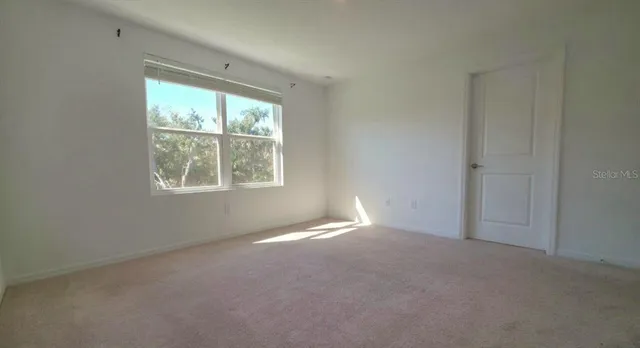 an empty room with windows