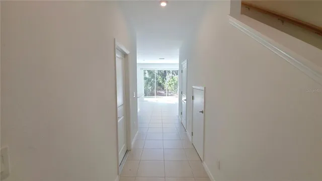 a view of a hallway with windows