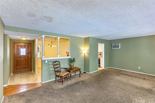 a view of a livingroom with furniture and windows