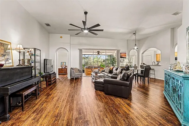a living room with fireplace furniture and a wooden floor