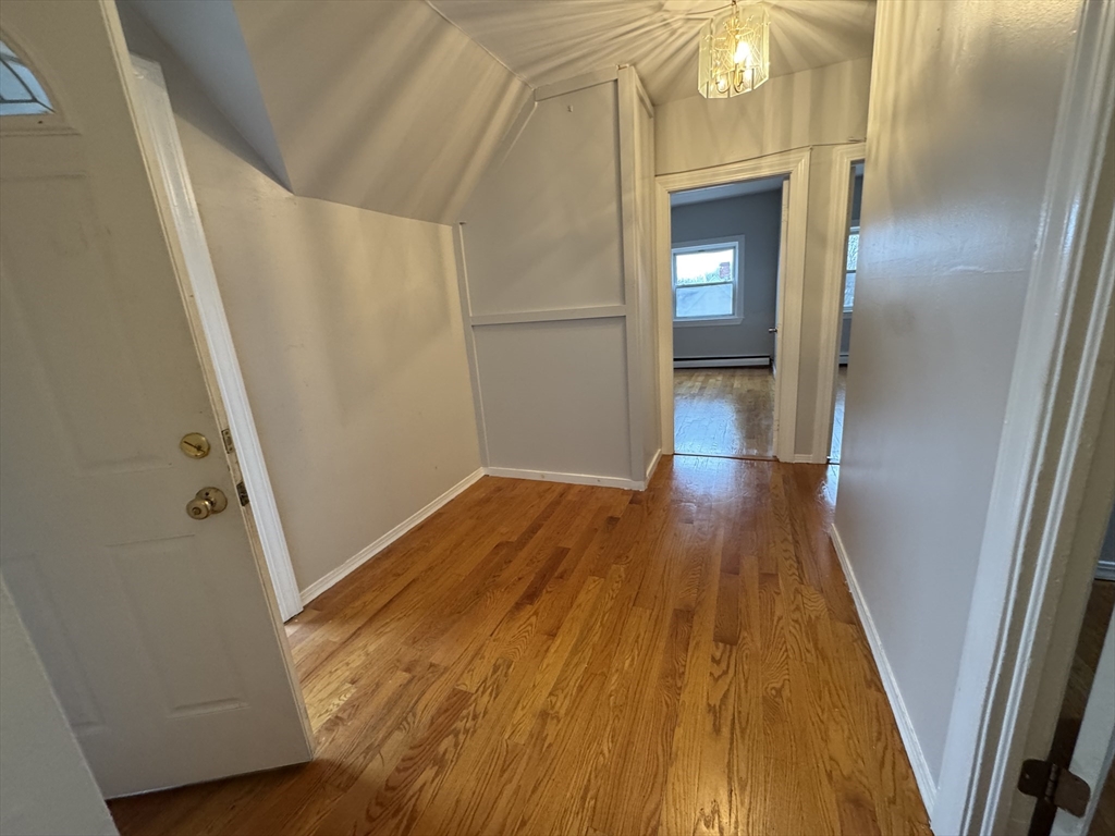 25 Amherst Street, Unit 4 Boston, MA 02131 - Photo 2 of 9 a view of front door with wooden floor