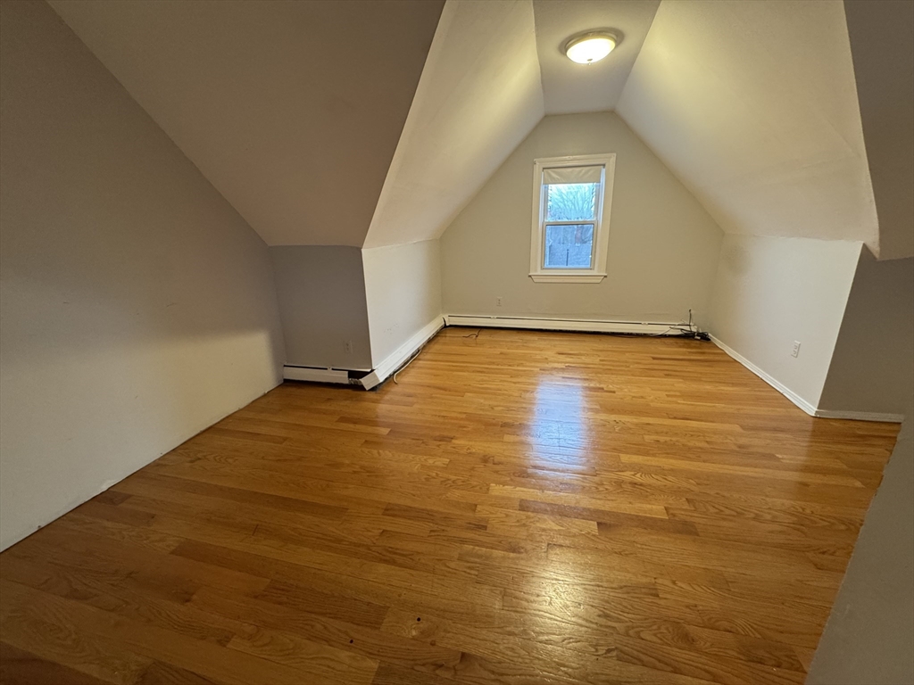 25 Amherst Street, Unit 4 Boston, MA 02131 - Photo 3 of 9 a view of a big room with wooden floor and windows
