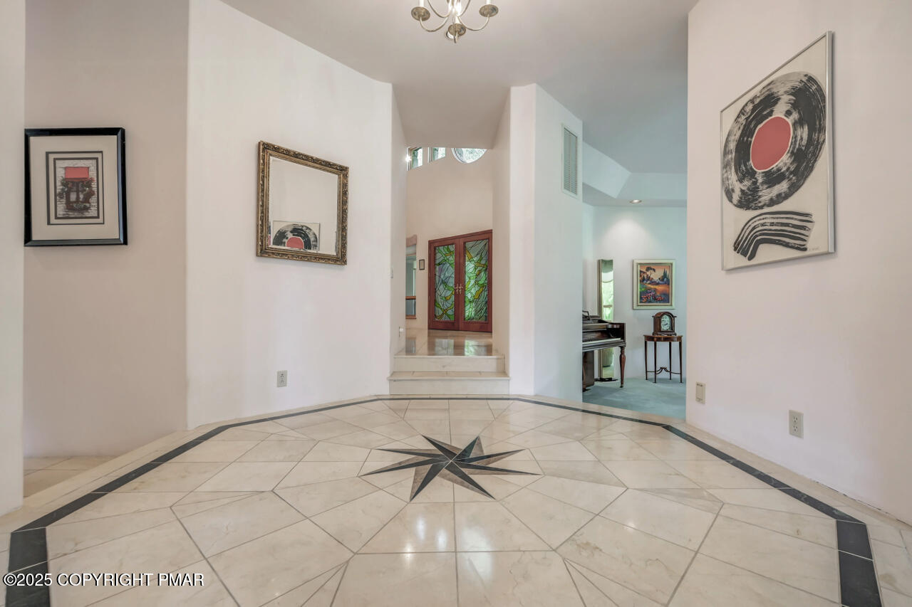 6696 Cherry Valley Road Stroudsburg, PA 18360 - Photo 15 of 97 a view of a hallway with paintings on the wall
