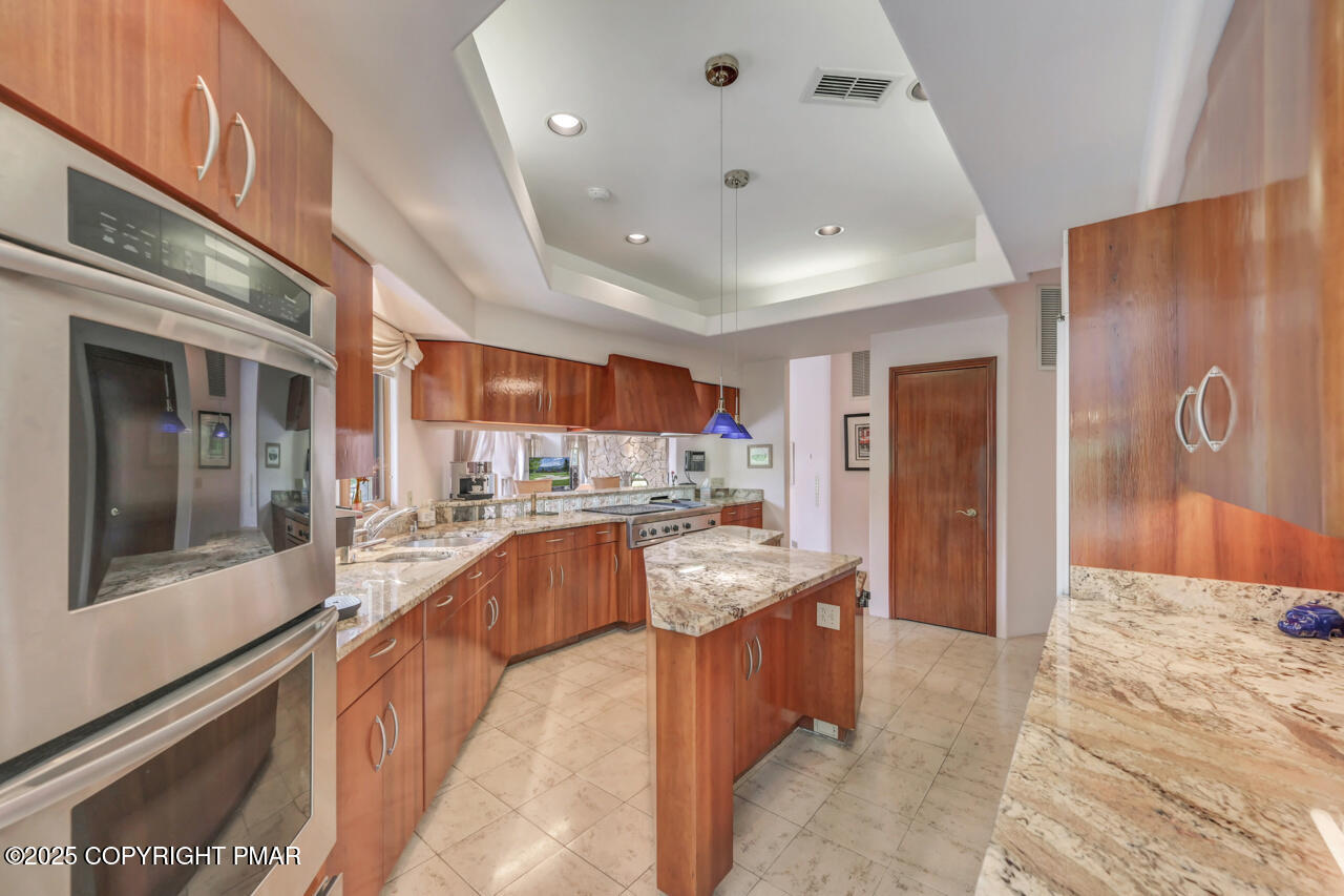 6696 Cherry Valley Road Stroudsburg, PA 18360 - Photo 28 of 97 a large kitchen with stainless steel appliances lots of counter top space