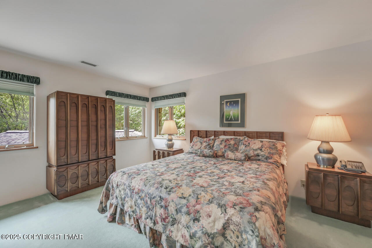 6696 Cherry Valley Road Stroudsburg, PA 18360 - Photo 69 of 97 a bedroom with a bed and a refrigerator